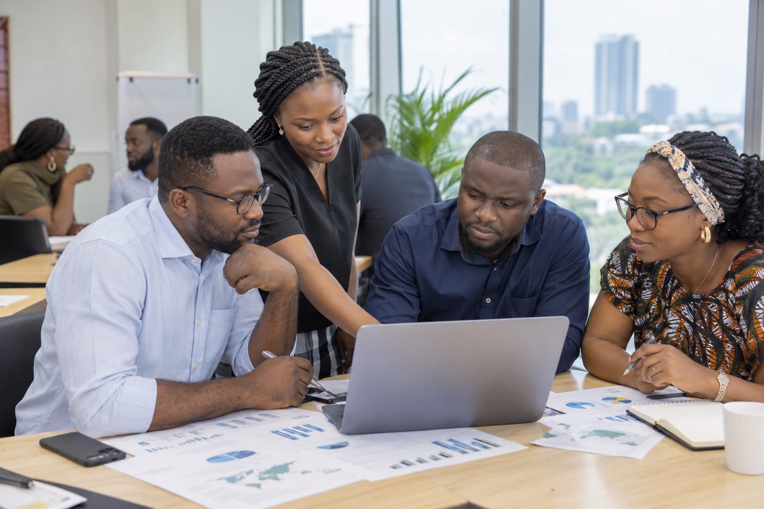 African clinical research professionals collaborating in a Nigerian training room