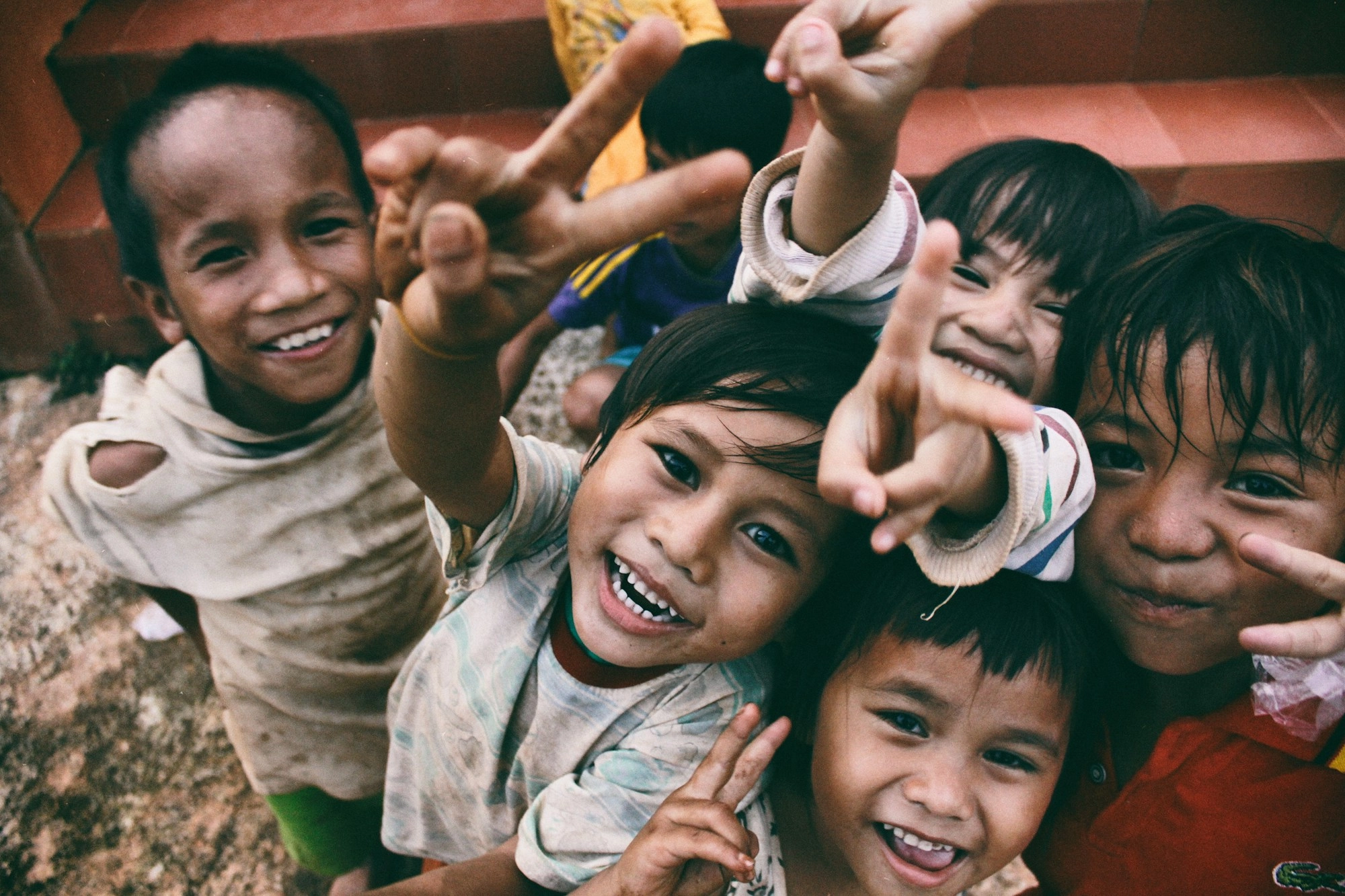 Children smiling at the camera.